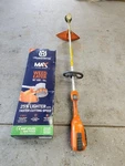 Husqvarna Electric 320IL Trimmer / Weed Eater With Battery And Charger. Fixed Price $199.00.