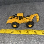 Is Ertl 1:64 Scale Diecast John Deere 648E Turbo Log Skidder Forestry Yellow. Fixed Price $24.95.