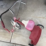 Radio Flyer Red Tricycle With White Seat And Rear Step, Wheels, Ages 3-7. Fixed Price $150.00.