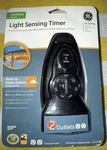 Ge Outdoor Light Sensing Timer, Weather Resistant, Dual Outlets, Model 15112. Fixed Price $15.00.