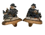 Set Of 2 Snowman & Child Metal Hanger Stocking Christmas Collections. Fixed Price $25.00.