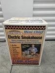 New Smokehouse Products Mini Chief Smoker Top Load Model # 9801. Fixed Price $150.00.